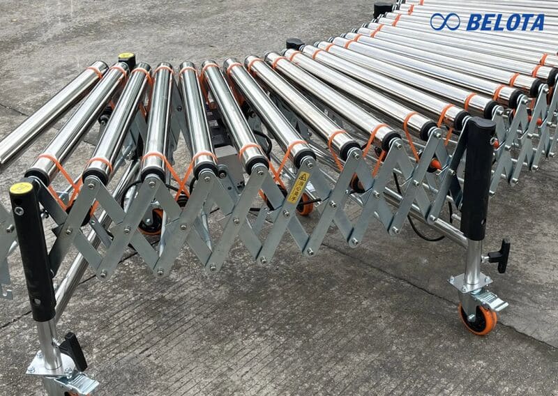 Băng tải con lăn xếp là dòng băng tải linh hoạt, có khả năng co giãn chiều dài