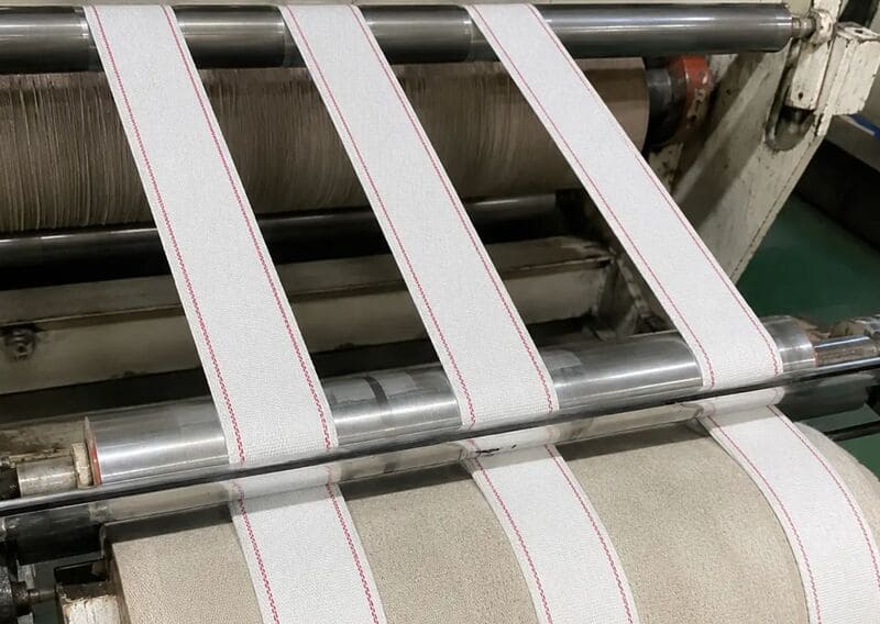 Dây đai cotton máy gấp có nhiệm vụ dẫn chuyển, giữ cố định và hỗ trợ quá trình gấp vải tự động
